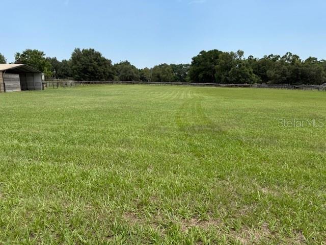 6020 NW 2nd Ave, Ocala, FL 34475 - view of yard featuring a detached carport and a view of rural / pastoral area