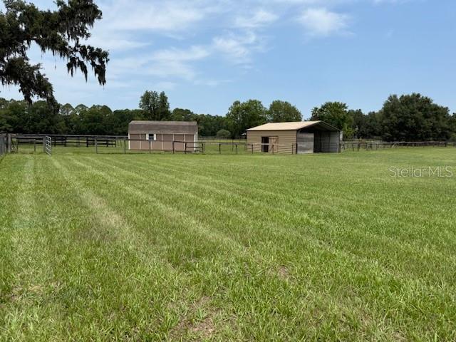 6020 NW 2nd Ave, Ocala, FL 34475 - view of yard with an outdoor structure and a view of countryside