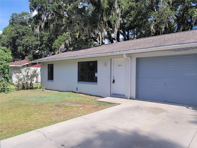 707/709 NE 26th St, Ocala, FL 34470 - ranch-style house with a front lawn, concrete block siding, driveway, and a shingled roof