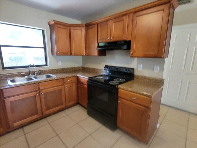707/709 NE 26th St, Ocala, FL 34470 - kitchen featuring black electric range oven, a sink, brown cabinetry, and under cabinet range hood