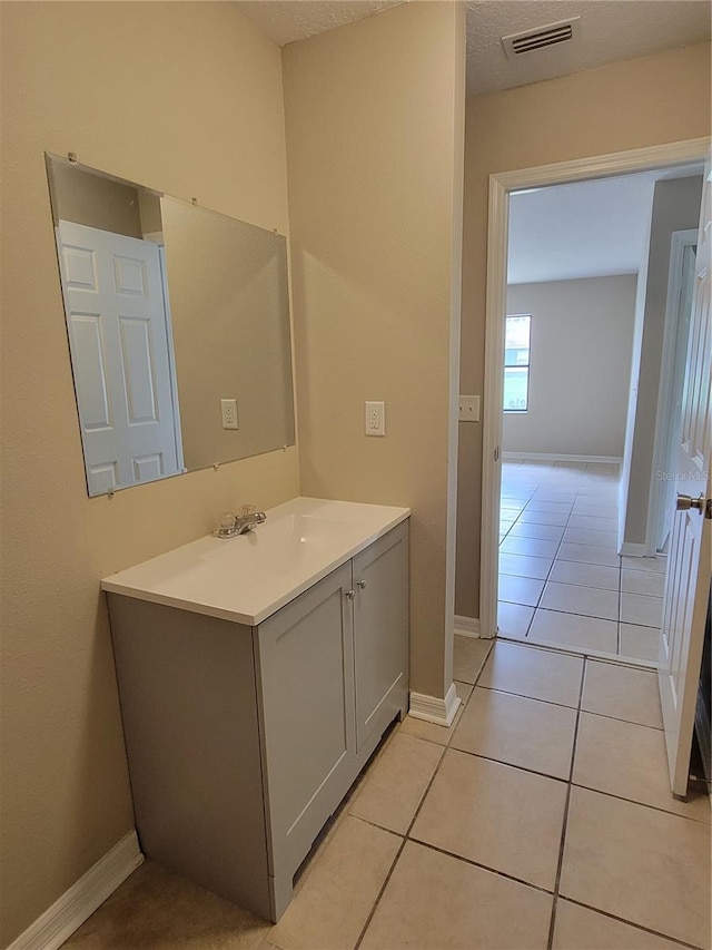 707/709 NE 26th St, Ocala, FL 34470 - bathroom with tile patterned flooring, vanity, baseboards, and visible vents