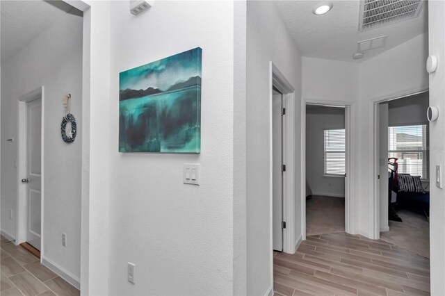 9312 SW 58th Cir, Ocala, FL 34476 - hallway with wood tiled floors and baseboards