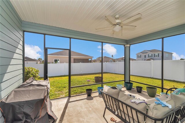 9312 SW 58th Cir, Ocala, FL 34476 - sunroom with an outdoor hangout area, a ceiling fan, and a residential view