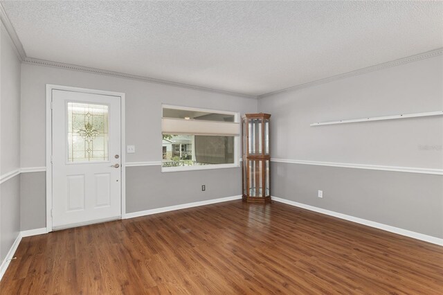 8645 SW 94th Ln Unit E, Ocala, FL 34481 - foyer entrance with a textured ceiling, wood finished floors, baseboards, and ornamental molding