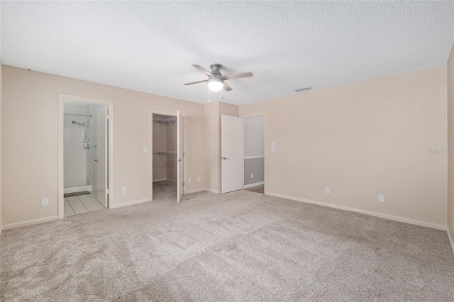8645 SW 94th Ln Unit E, Ocala, FL 34481 - unfurnished bedroom featuring a closet, baseboards, a spacious closet, visible vents, and carpet