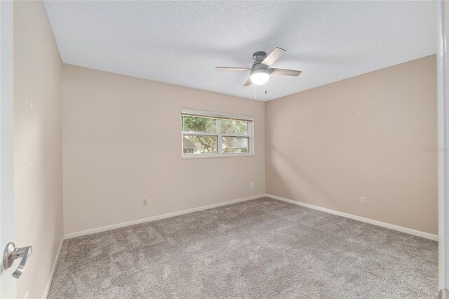 8645 SW 94th Ln Unit E, Ocala, FL 34481 - empty room featuring ceiling fan, carpet, baseboards, and a textured ceiling