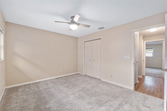 8645 SW 94th Ln Unit E, Ocala, FL 34481 - unfurnished bedroom featuring a closet, carpet flooring, and baseboards