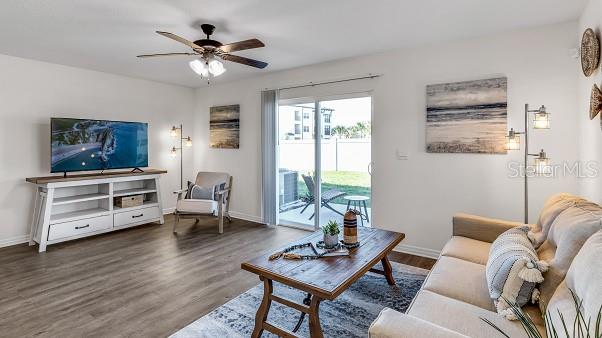 6577 SW 81st Loop, Ocala, FL 34476 - living room featuring baseboards, wood finished floors, and ceiling fan