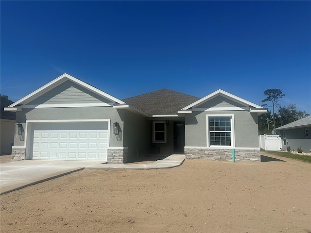 4810 NW 11th Ct, Ocala, FL 34475 - ranch-style house with fence, stone siding, driveway, a gate, and a garage