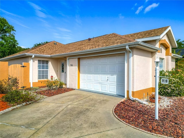916 Cancun Ct, Lady Lake, FL 32159 - ranch-style house with concrete driveway, stucco siding, roof with shingles, and an attached garage