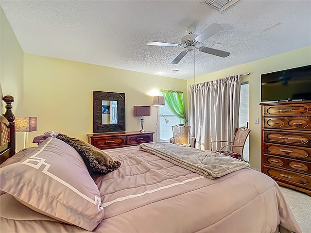 916 Cancun Ct, Lady Lake, FL 32159 - carpeted bedroom with visible vents, ceiling fan, and a textured ceiling