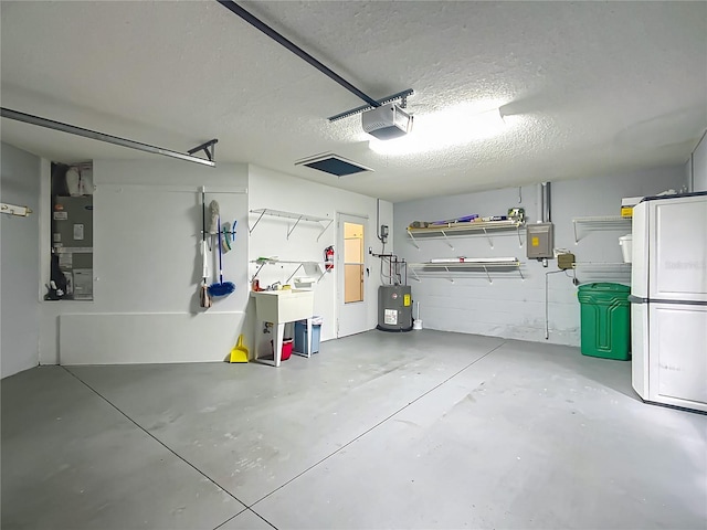 916 Cancun Ct, Lady Lake, FL 32159 - garage with water heater, heating unit, a sink, and a garage door opener