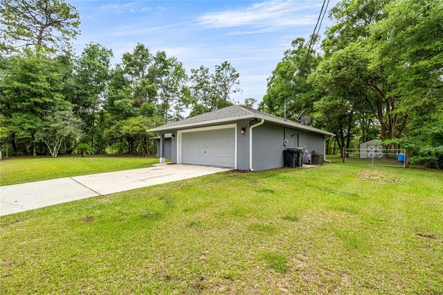 5118 SW 197th Ter, Dunnellon, FL 34431 - view of home's exterior featuring driveway, central AC unit, stucco siding, and view of scattered trees