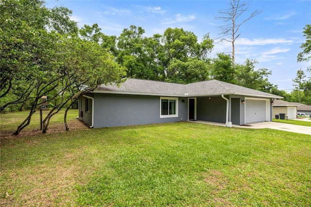 5118 SW 197th Ter, Dunnellon, FL 34431 - ranch-style home with an attached garage, driveway, stucco siding, and a front lawn
