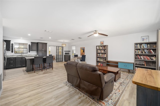 6549 NW 65th Pl, Ocala, FL 34482 - living area featuring light wood-style flooring, recessed lighting, ceiling fan, and visible vents
