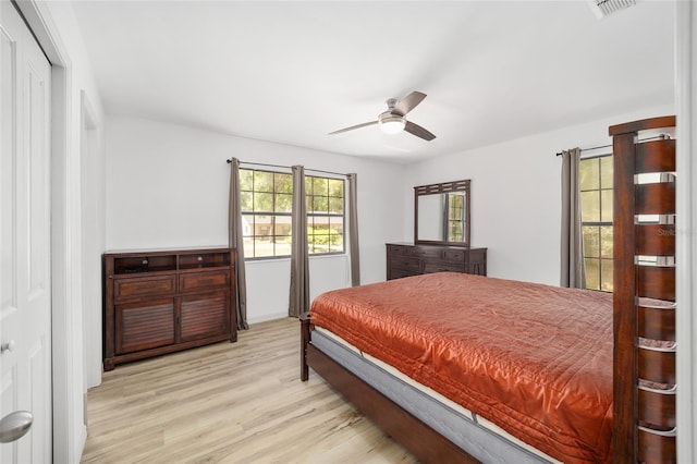 6549 NW 65th Pl, Ocala, FL 34482 - bedroom featuring visible vents, a closet, light wood-style floors, and ceiling fan