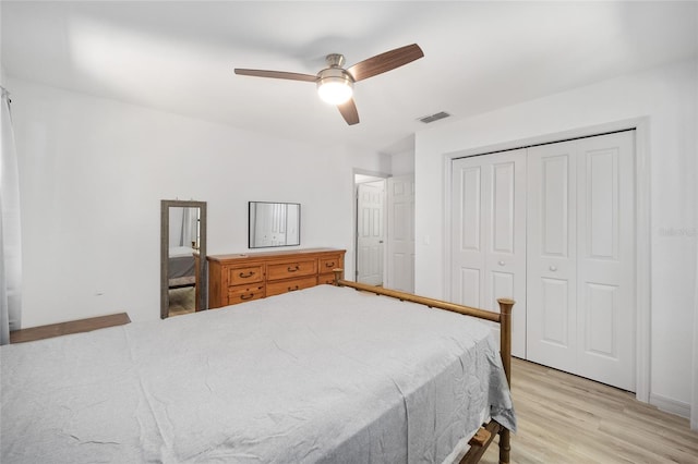 6549 NW 65th Pl, Ocala, FL 34482 - bedroom with a closet, visible vents, light wood-style floors, and a ceiling fan