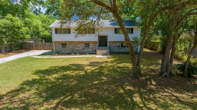 341 SE 53rd Ct, Ocala, FL 34480 - view of front of home featuring brick siding, a front yard, fence, and entry steps