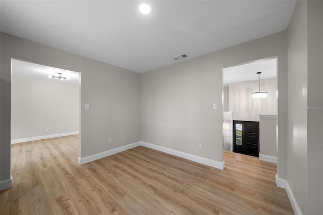 341 SE 53rd Ct, Ocala, FL 34480 - unfurnished living room featuring baseboards, visible vents, and light wood finished floors