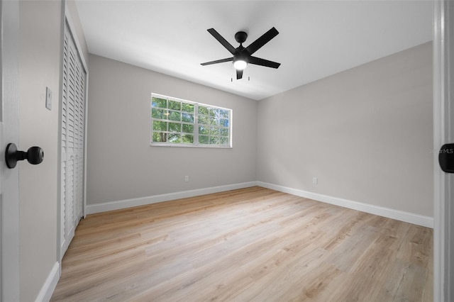 341 SE 53rd Ct, Ocala, FL 34480 - unfurnished bedroom featuring a closet, baseboards, light wood-style floors, and ceiling fan