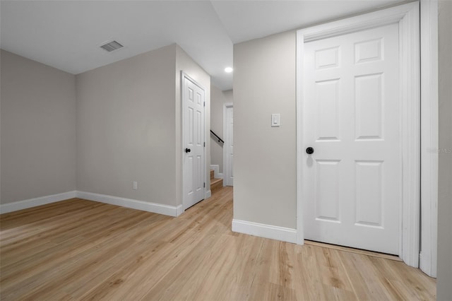 341 SE 53rd Ct, Ocala, FL 34480 - spare room featuring stairway, baseboards, light wood finished floors, and visible vents