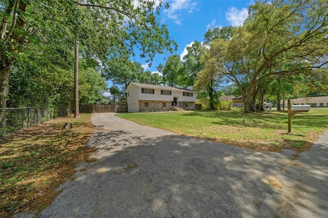 341 SE 53rd Ct, Ocala, FL 34480 - bi-level home with fence, driveway, crawl space, a front yard, and a chimney