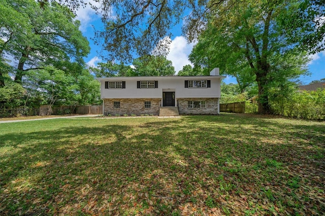 341 SE 53rd Ct, Ocala, FL 34480 - raised ranch with a front yard, fence, and entry steps