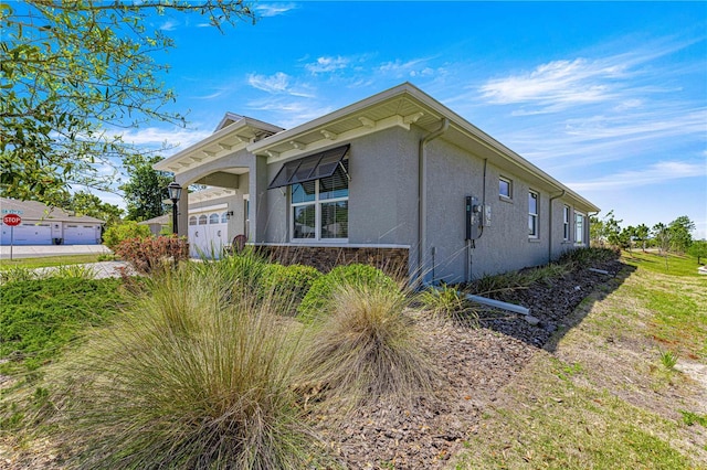 9342 SW 102nd Terrace Rd, Ocala, FL 34481 - view of side of property featuring stucco siding