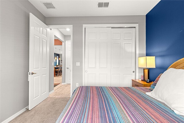 9342 SW 102nd Terrace Rd, Ocala, FL 34481 - carpeted bedroom with baseboards, a closet, and visible vents