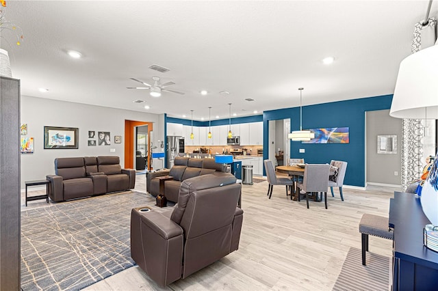 9342 SW 102nd Terrace Rd, Ocala, FL 34481 - living area with visible vents, light wood-style flooring, recessed lighting, and a ceiling fan