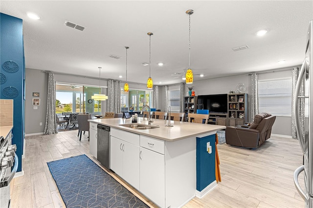 9342 SW 102nd Terrace Rd, Ocala, FL 34481 - kitchen featuring open floor plan, stainless steel appliances, a center island with sink, a sink, and visible vents
