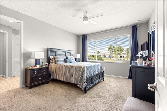 9342 SW 102nd Terrace Rd, Ocala, FL 34481 - bedroom with light carpet, baseboards, and a textured ceiling