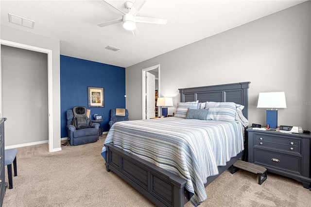 9342 SW 102nd Terrace Rd, Ocala, FL 34481 - bedroom with baseboards, visible vents, a ceiling fan, and light carpet
