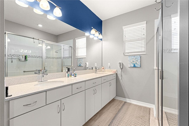 9342 SW 102nd Terrace Rd, Ocala, FL 34481 - full bath featuring baseboards, double vanity, a sink, and a stall shower