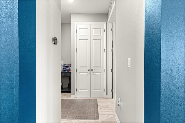9342 SW 102nd Terrace Rd, Ocala, FL 34481 - hallway featuring light wood-style flooring and baseboards