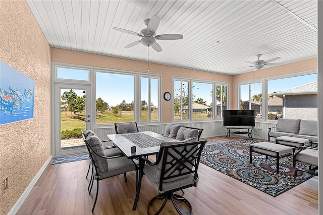 9342 SW 102nd Terrace Rd, Ocala, FL 34481 - sunroom / solarium featuring wood finished floors, an outdoor hangout area, outdoor dining space, and ceiling fan