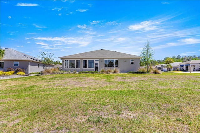 9342 SW 102nd Terrace Rd, Ocala, FL 34481 - rear view of house featuring a lawn