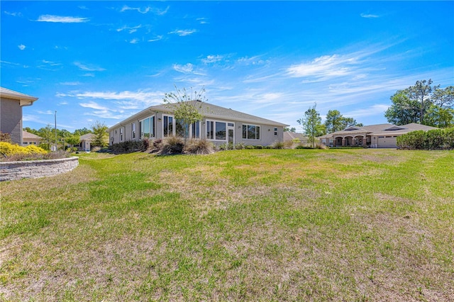 9342 SW 102nd Terrace Rd, Ocala, FL 34481 - back of house featuring a lawn
