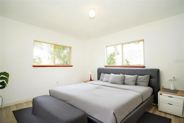 bedroom featuring light wood-style floors