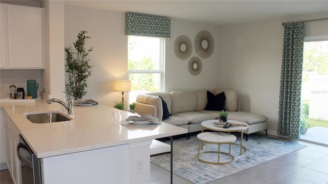 6579 SW 81st Loop, Ocala, FL 34476 - tiled living area with a sink and a wealth of natural light