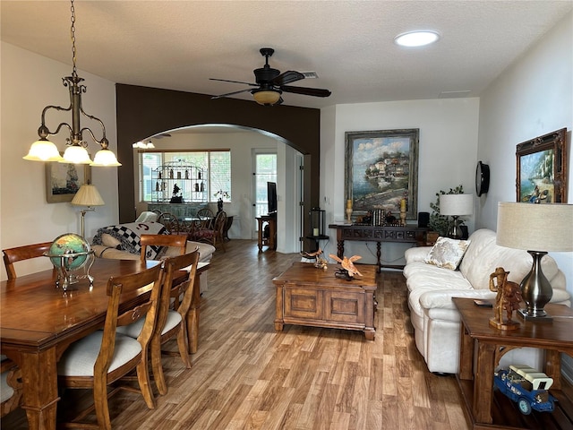 9053 SW 103rd Ave, Ocala, FL 34481 - living room featuring arched walkways, a ceiling fan, and light wood-type flooring