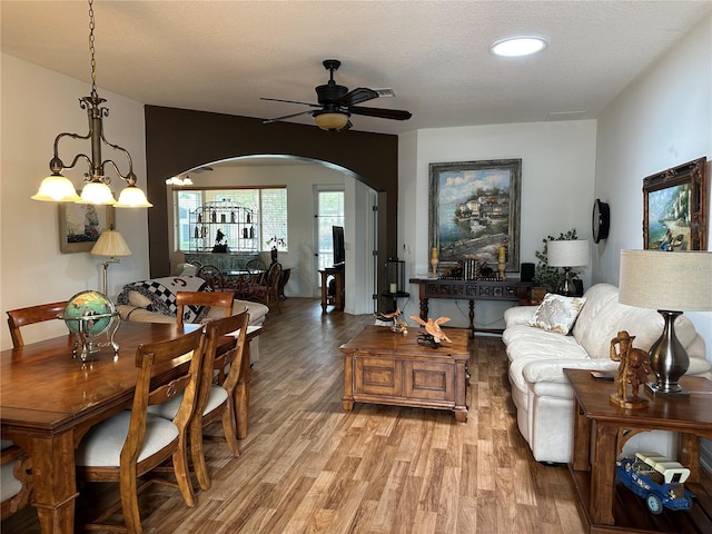 9053 SW 103rd Ave, Ocala, FL 34481 - living area featuring arched walkways, ceiling fan, and light wood finished floors