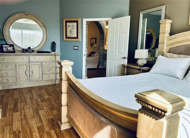 9053 SW 103rd Ave, Ocala, FL 34481 - bedroom with dark wood-style flooring and arched walkways
