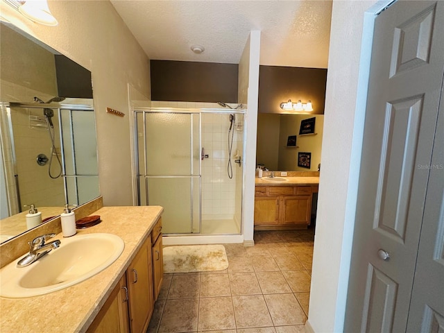 9053 SW 103rd Ave, Ocala, FL 34481 - full bathroom with a stall shower, two vanities, and tile patterned flooring