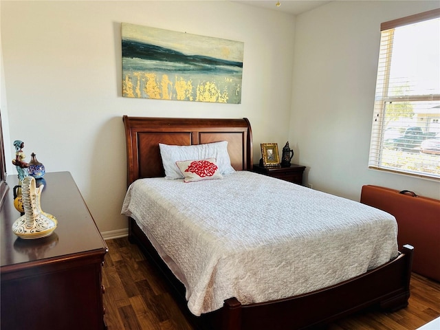 9053 SW 103rd Ave, Ocala, FL 34481 - bedroom featuring dark wood-style floors, multiple windows, and baseboards