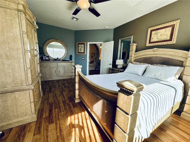 9053 SW 103rd Ave, Ocala, FL 34481 - bedroom with dark wood-style floors, ceiling fan, a textured ceiling, and arched walkways