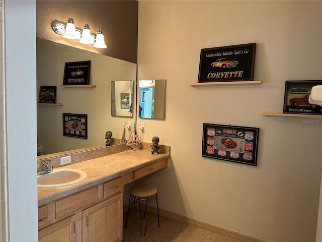 9053 SW 103rd Ave, Ocala, FL 34481 - bathroom with vanity, tile patterned floors, and baseboards