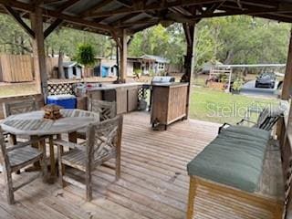 4540 W Sandy Hill St, Lecanto, FL 34461 - wooden deck with a gazebo and outdoor dining space