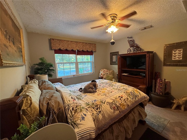 4540 W Sandy Hill St, Lecanto, FL 34461 - bedroom featuring a textured ceiling, a ceiling fan, and carpet floors