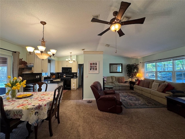 4540 W Sandy Hill St, Lecanto, FL 34461 - dining space featuring a chandelier, a textured ceiling, dark carpet, lofted ceiling, and a ceiling fan